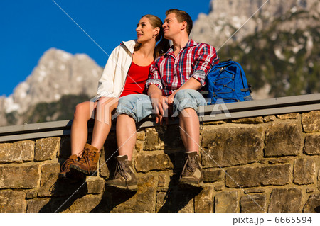 Happy Couple hiking in alp mountains Happy Couple hiking in alp mountains 6665594