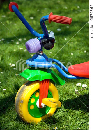 Tricycle in the garden. Tricycle in the garden. 6676362