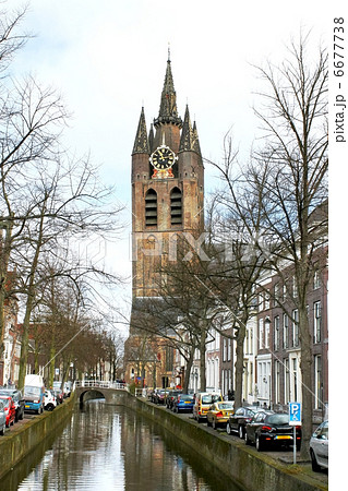Canal and church tower in Delft, Netherlands Canal and church tower in Delft, Netherlands 6677738