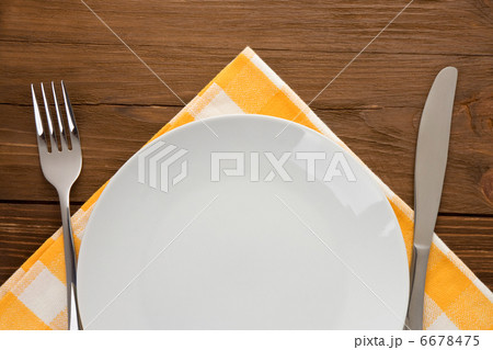 plate, knife and fork on wood 6678475