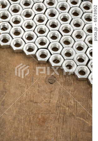 metal nuts tool on wood 6678902