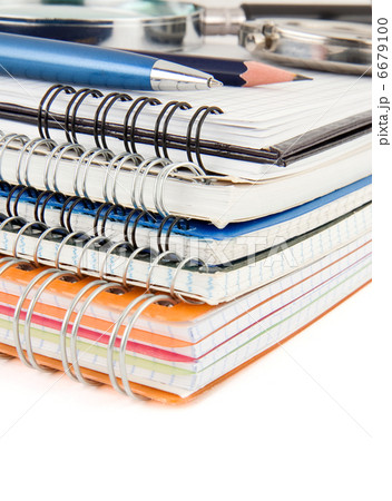 pen and pencil at notebook isolated on white 6679100