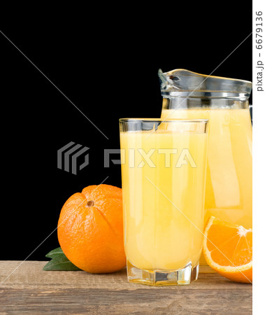 orange juice and fruit  on black 6679136