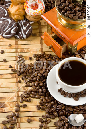 cup full of coffee, beans, pot and grinder 6679146