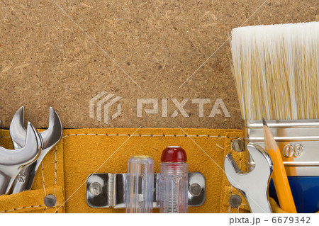 tools in belt on wood background tools in belt on wood background 6679342