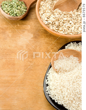 oat, rice, pea in wood plate and spoon oat, rice, pea in wood plate and spoon 6679579