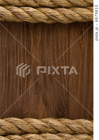 ship ropes on wood background 6679810