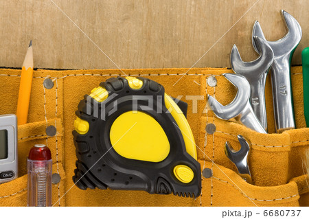 tools in construction belt on wooden background 6680737