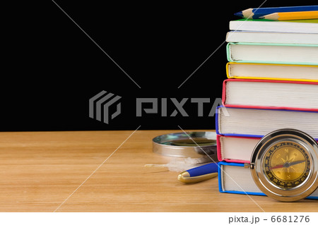back to school supplies and books isolated on black 6681276