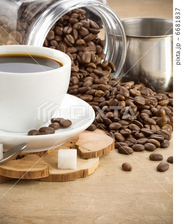 cup of coffee and jar with beans 6681837