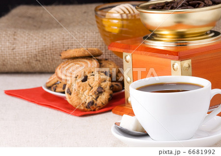 cup of coffee, honey and grinder on sacking 6681992