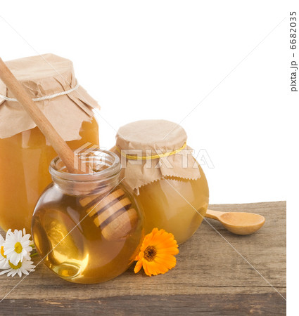 jar of honey and stick jar of honey and stick 6682035