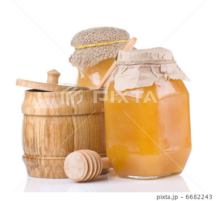 jars and pot full of honey isolated on white 6682243