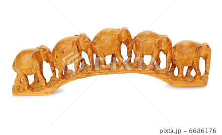 five wooden elephants walking together isolated on white background five wooden elephants walking together isolated on white background 6686176