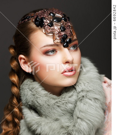 Braided Hair Luxurious Woman in Fur Collar and Gemstones. Jewels 6692842