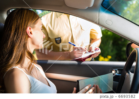 Police - woman in traffic violation getting ticket 6693582