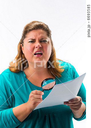 Woman looking through magnifying glass or loupe 6693585