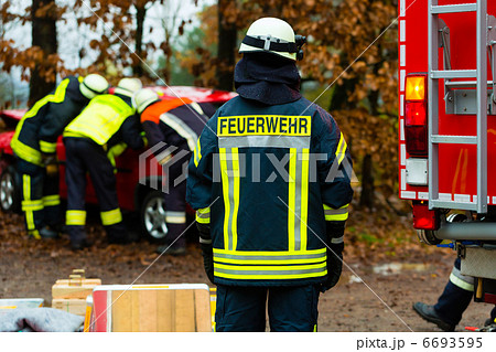 Accident - Fire brigade rescues Victim of a car Accident - Fire brigade rescues Victim of a car 6693595