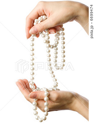 Pearl in woman's hands 6699474