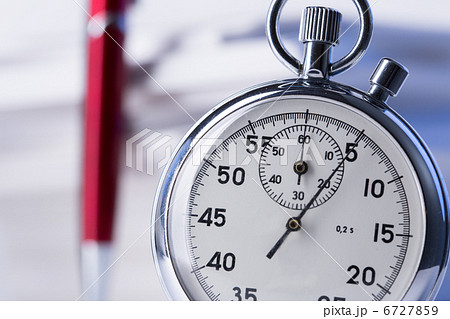 Stopwatch and pen on background of paper cards 6727859