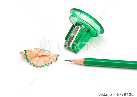 Green sharpener and pencil on white background. Green sharpener and pencil on white background. 6729406
