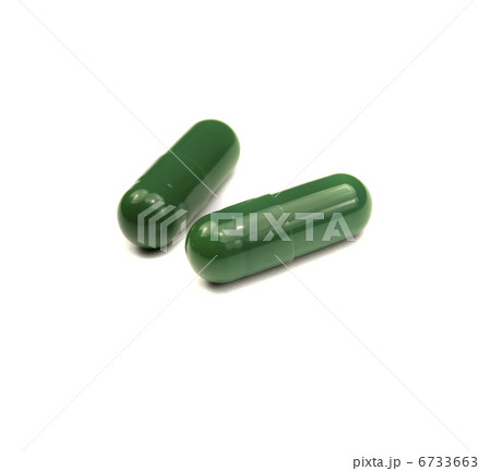 Two green pills isolated Two green pills isolated 6733663