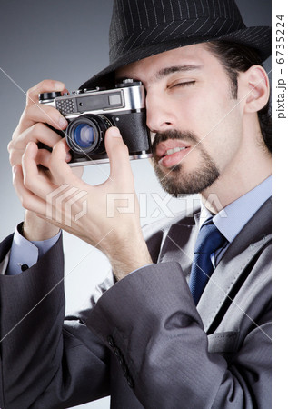 Photographer man with vintage camera 6735224