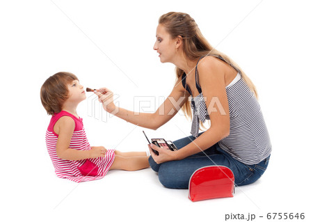 Young mother paints little girl cosmetics 6755646