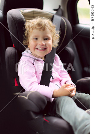 Child in an automobile armchair Child in an automobile armchair 6760648