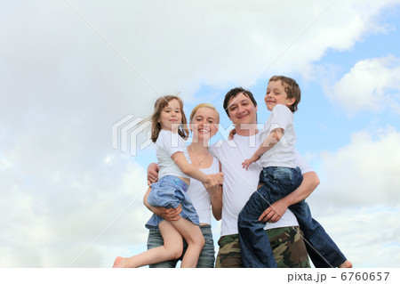 Cheerful family with two children 6760657