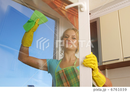 Women cleaning a window 2 Women cleaning a window 2 6761039