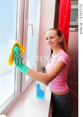 Woman cleaning window Woman cleaning window 6761570