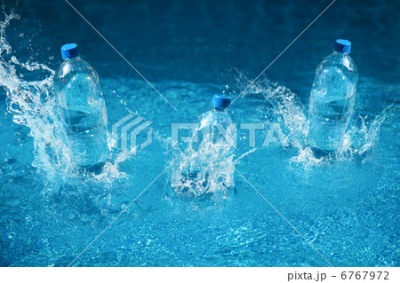 Three bottle of water drop with splash. Shot in motion Three bottle of water drop with splash. Shot in motion 6767972