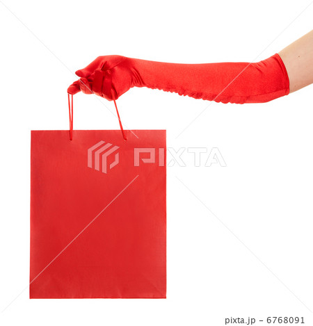 Hand in red gloves holding bag isolated over white background 6768091