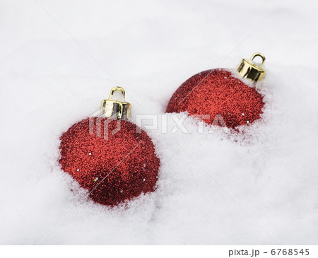 two christmas baubles in white snow 6768545