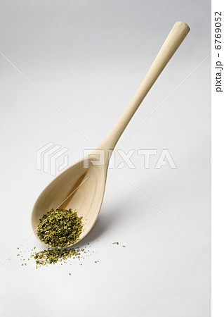Spoon and parsley isolated on white Spoon and parsley isolated on white 6769052
