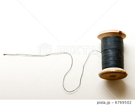 Thread bobbin on white background 6769502