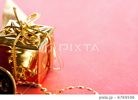 Gift box with bow on a red background 6769506