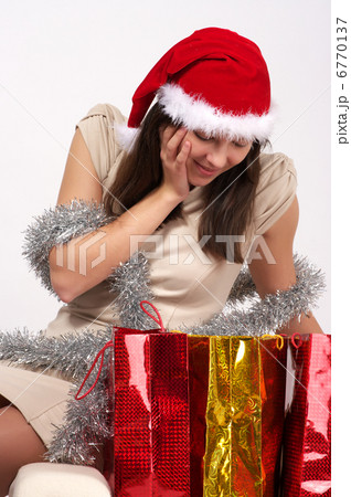 Beautiful woman looking into shopping bags 6770137