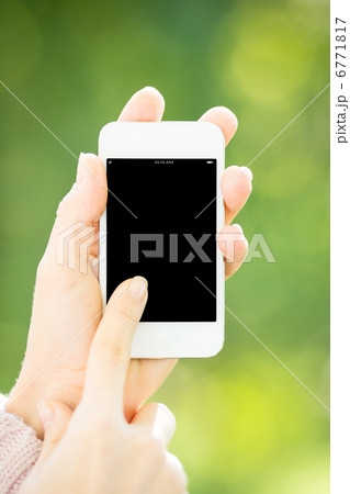 Woman holding smartphone Woman holding smartphone 6771817