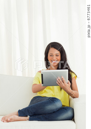 Happy Latino using a touch pad 6773461