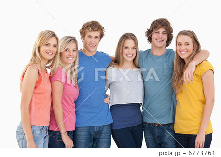 A group of friends smiling and holding each other A group of friends smiling and holding each other 6773761