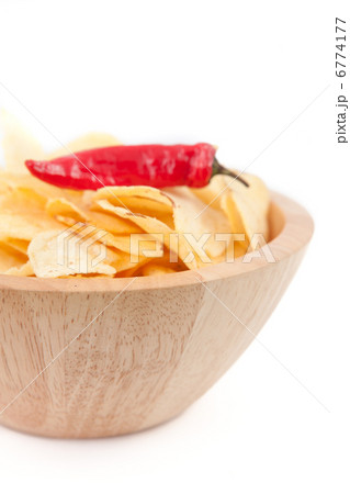 Pimento on a wooden bowl of chips 6774177