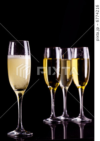 Four full flutes of champagne Four full flutes of champagne 6774216