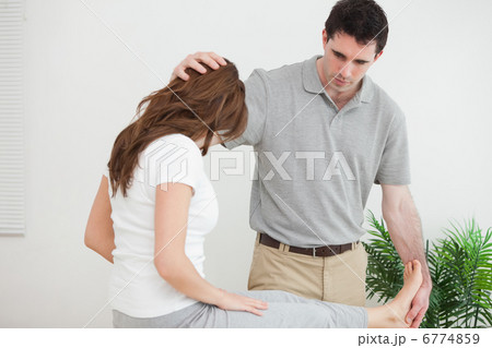 Serious doctor examining his patient Serious doctor examining his patient 6774859