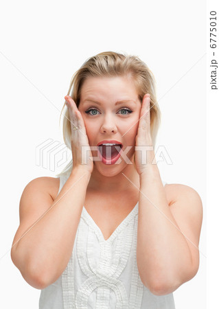 Surprised blonde woman standing with her mouth opened Surprised blonde woman standing with her mouth opened 6775010