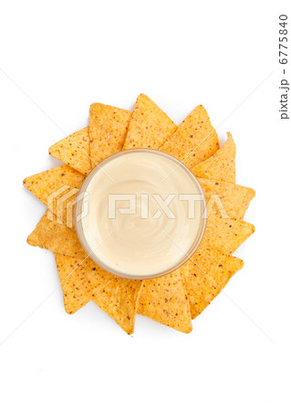 Nachos placed around a bowl of white dip Nachos placed around a bowl of white dip 6775840