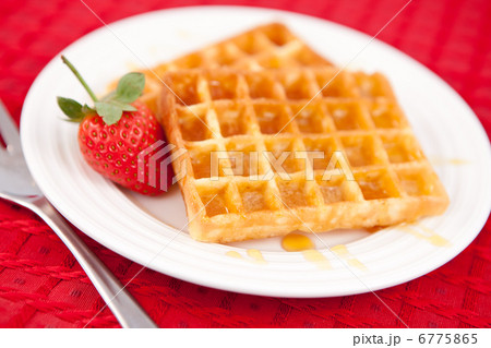 Waffles and strawberry together in a white plate Waffles and strawberry together in a white plate 6775865