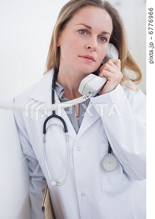 Doctor holding a phone Doctor holding a phone 6776966