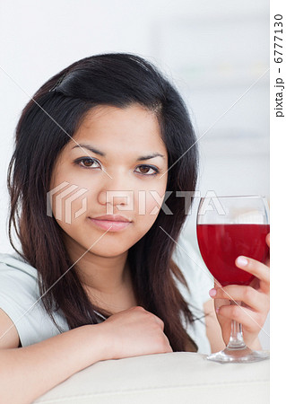 Close-up of a woman holding a glass of wine Close-up of a woman holding a glass of wine 6777130